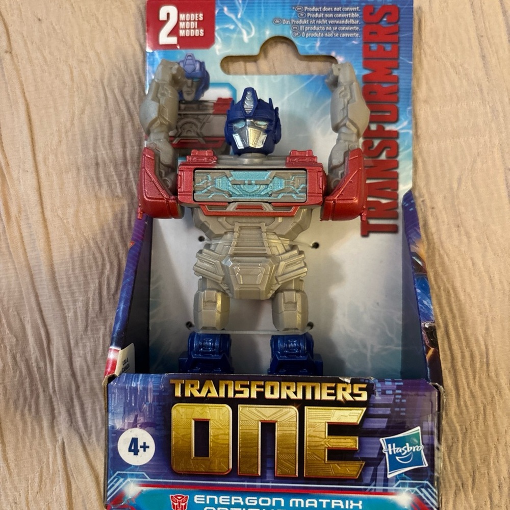 Hasbro Transformers One Action Figure - Red, Blue, Gray